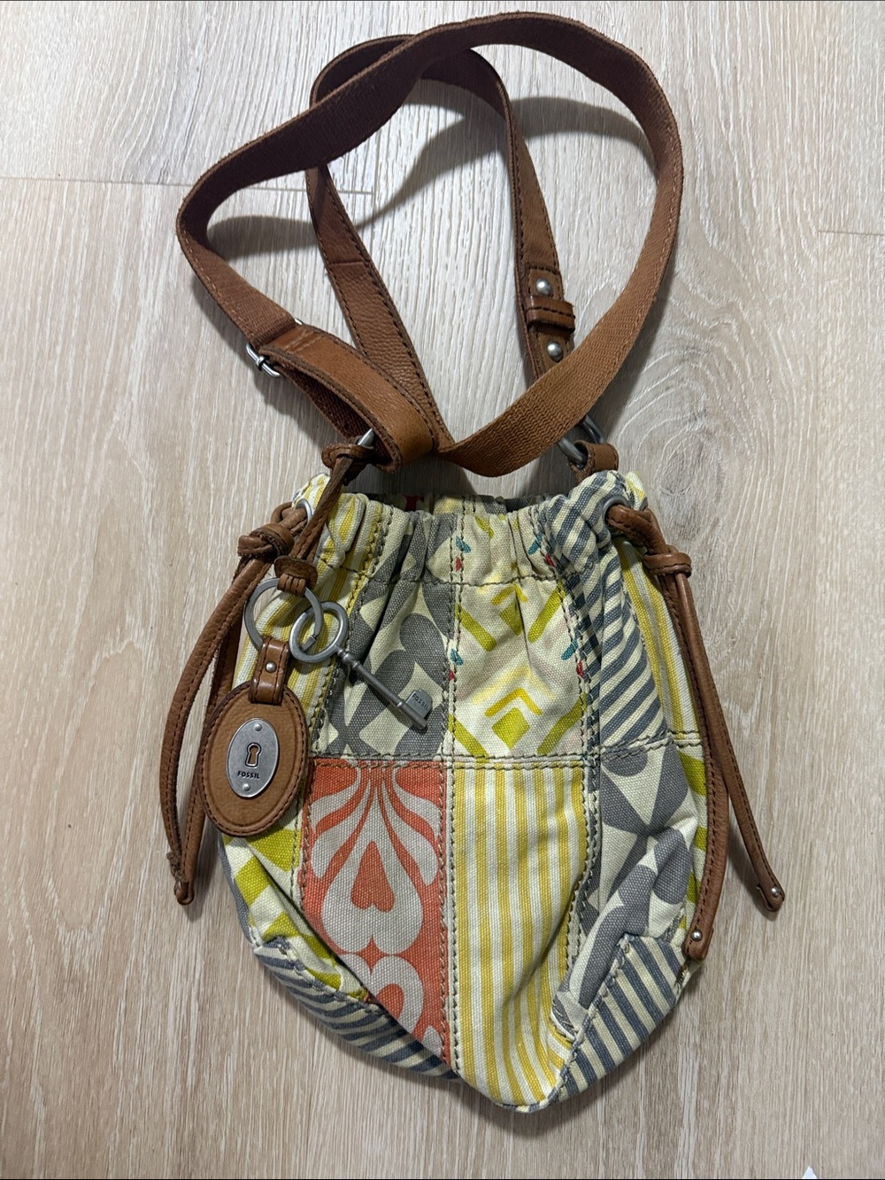 Fossil Patchwork Drawstring Crossbody Bag in Brown and Yellow-Orange Multi